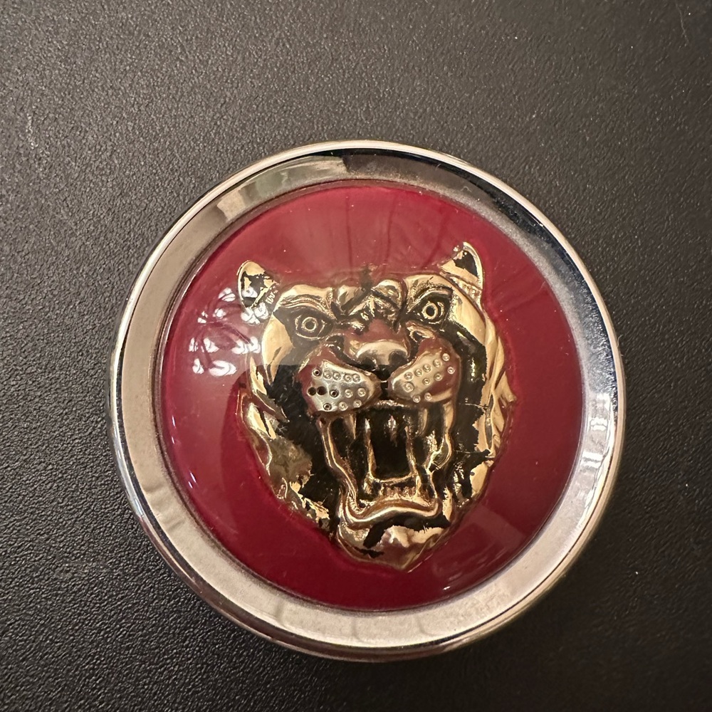 Genuine Jaguar OEM bright red center Cap Badge Growler.
